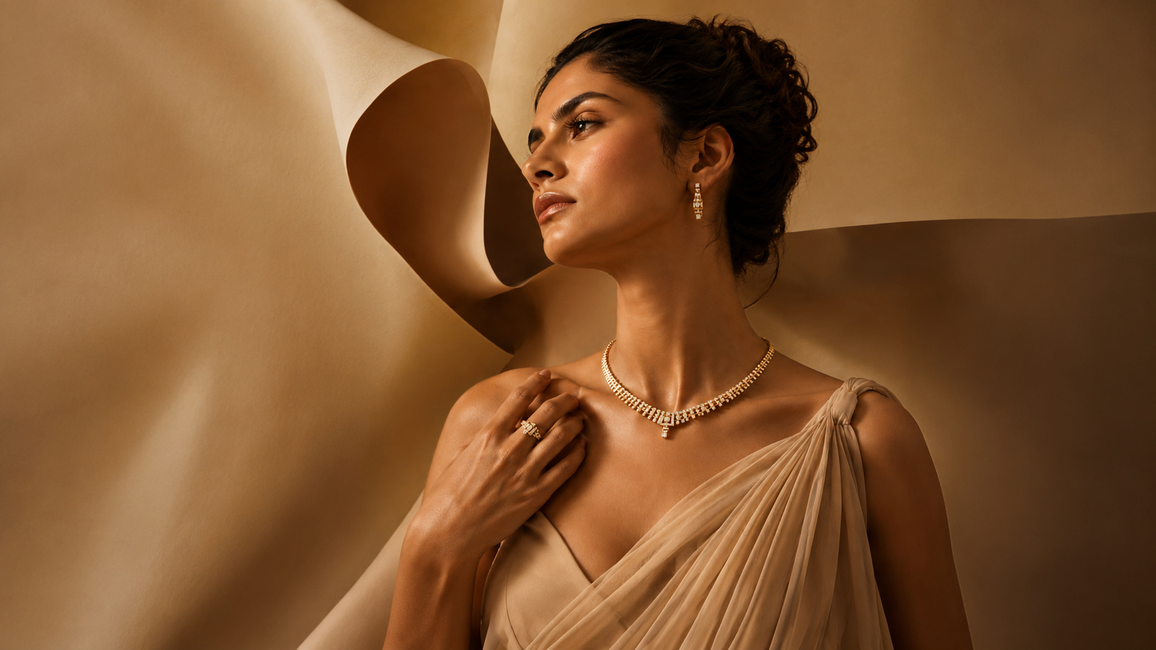 Close editorial portrait of a gold and diamond necklace resting on the collarbone